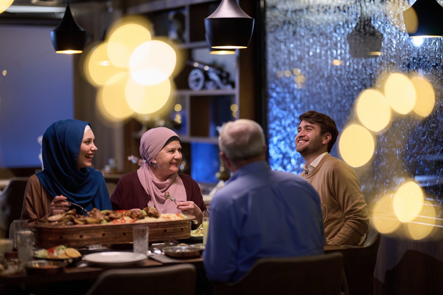 Family sharing a meal in a restaurant